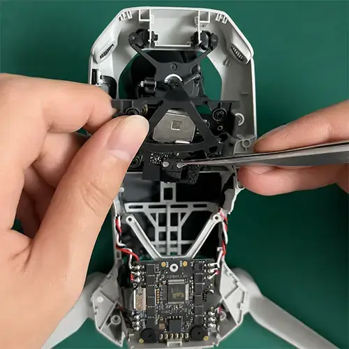 DJI Mini 4 Pro Gimbal Ribbon Cable Replacement: A 7-Step Essential Guide 3 DJI Mini 4 Pro gimbal ribbon cable replacement - opening ZIF connector on main board during repair